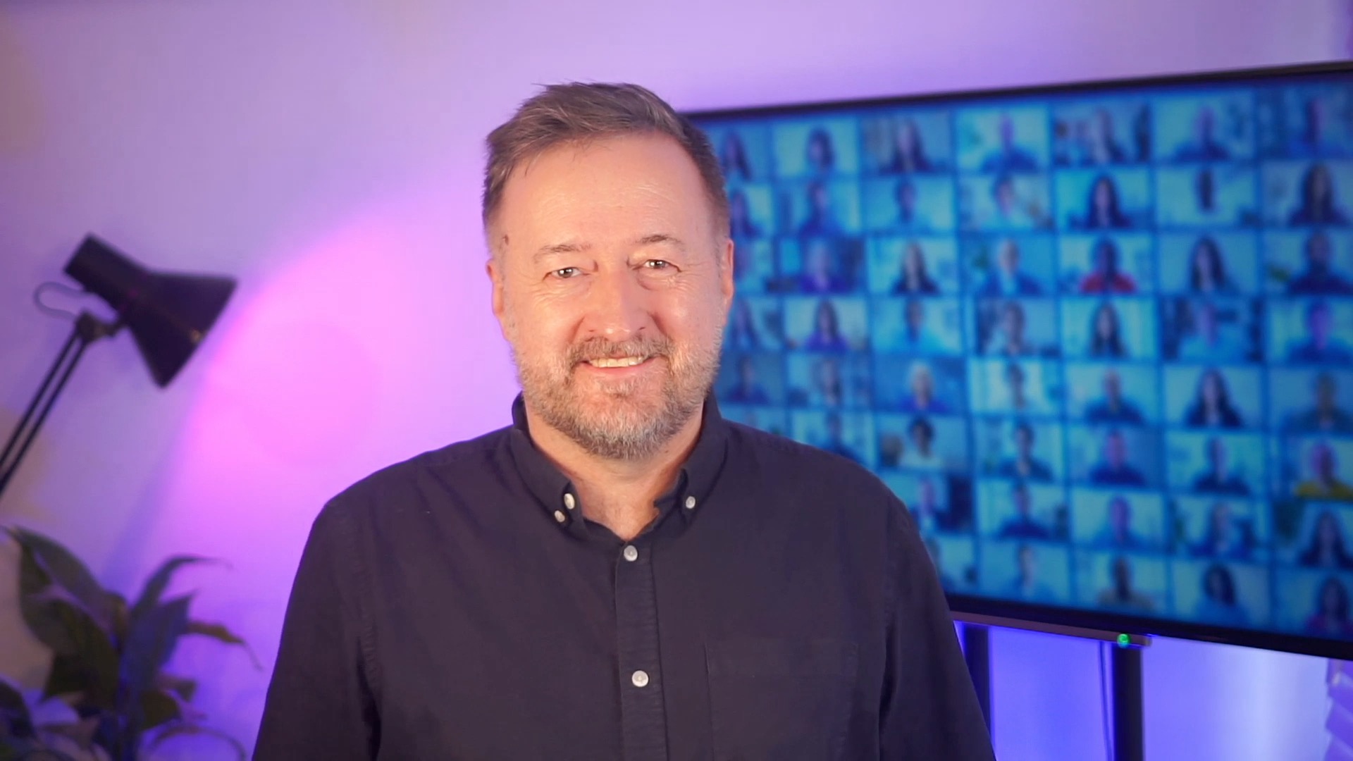 Mark Egan smiling in his video studio